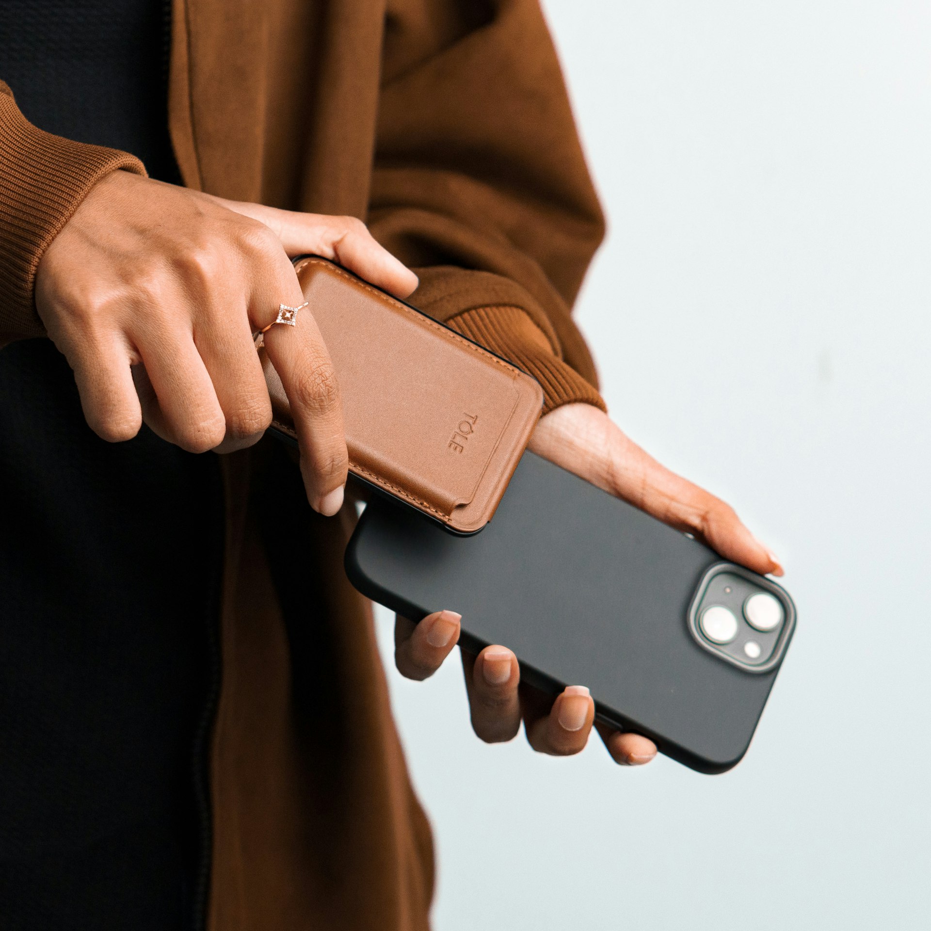 a person holding a cell phone in their hand